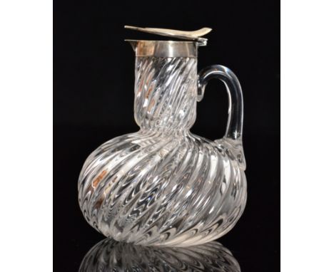 A late 19th Century Stourbridge clear crystal Whiskey Noggin of wrythen fluted globe and shaft form with loop handle all belo