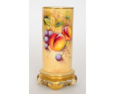 A Royal Worcester fruit painted cylindrical vase panel decorated by W. Roberts with peaches and grapes, the foot formed as a 