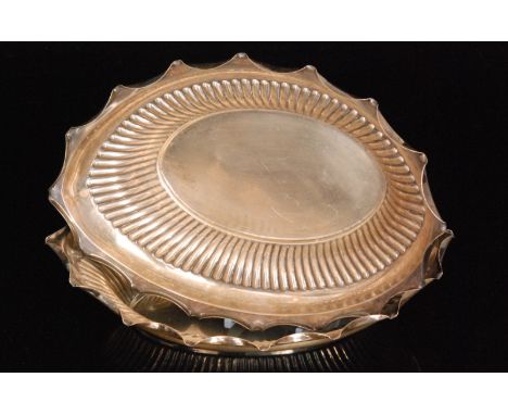 A pair of late 19th Century hallmarked silver oval bread baskets each with part fluted sides below crimped borders, length 29