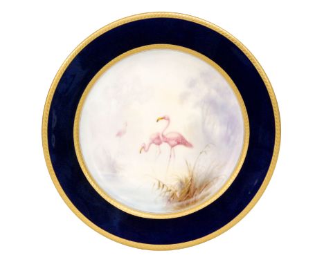 A Royal Worcester cabinet plate decorated by Johnson with three hand painted flamingo stood amidst grasses, the border edge i