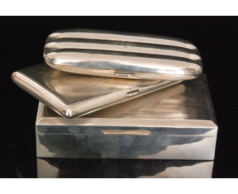 A George V hallmarked silver rectangular three section cigar case of plain form with gilt interior, a rectangular cedar lined