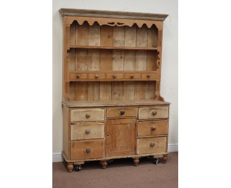 19th century pine dresser fitted with seven drawers and centre cupboard, and later two heights plate rack with five spice dra