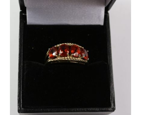 Four stone garnet ring hallmarked 9ct Condition Report Click here for further images, condition, auction times & delivery cos