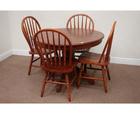 Circular walnut finish dining table (D108cm, H72cm), and four stick and hoop back chairs Condition Report Click here for furt