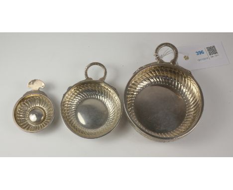 Matched set of three French silver wine tasters, - Paris circa 1800 inscibed 'Bouniol', maker's mark F.B D under urn in lozen