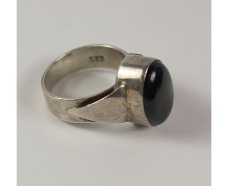 Silver ring set with a large polished blue stone stamped 925 Condition Report Click here for further images, condition, aucti