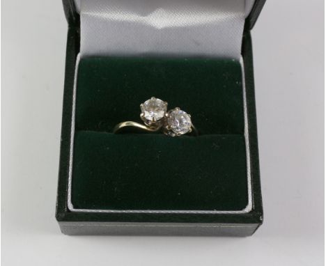 Two stone cross-over dress ring hallmarked 9ct Condition Report Click here for further images, condition, auction times & del