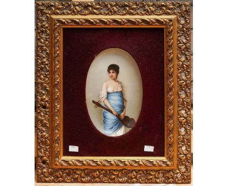 A Continental probably Austrian early 20th Century oval porcelain plaque painted with a portrait of a Woman in Classical robe