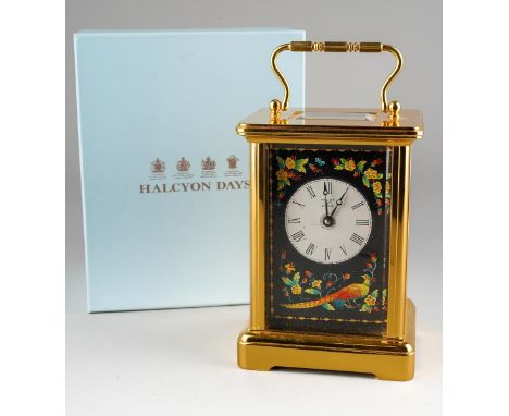 A boxed Halcyon Days brass cased carriage clock, with enamel panels to the dial and sides decorated with exotic birds and flo