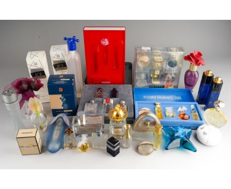 A collection of modern perfume bottles, some with residual or full contents, includes boxed and loose miniatures, brands incl