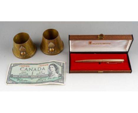 A gold plated Parker ball pen engraved with initials, in a Papermate box, together with two trench art shell case items and a