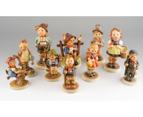 A collection of ten Goebel Figures including She Loves Me, She Loves me Not 1953; Singing Boy 137; Girl with watering can; Sc