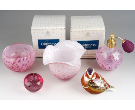 A boxed Caithness glass atomiser, a similar pink glass bowl, height 6.5cm, a small apple shaped glass paperweight, a wavy rim