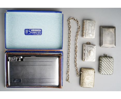 A George V silver engine turned match case, hallmarked by E J Trevitt &amp; Sons Ltd, Chester, 1926 together with four variou