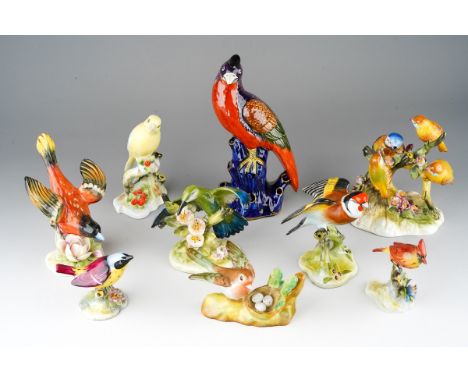 A Shancock &amp; Sons early 20th Century Exotic bird Parrot posy vase, on cobalt blue tree stump, factory stamp, damage to be