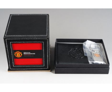 A Manchester United Japan Quartz watch on leather strap, in official merchandise box (not tested) together with a leather cre