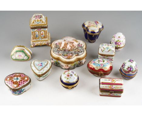 A collection of twelve late 19th and early 20th century Continental porcelain trinket, pill and scent flask boxes, including 