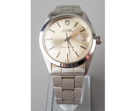 A Vintage Tudor OysterDate wristwatch. The silver tone dial, with black enamel silver tone illuminous hourly applied marks, i