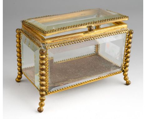 A Palais Royale style bevelled glass and gilt metal jewellery casket, on bobbin supports, approx 12cm wide x 7cm deep x 7.2cm