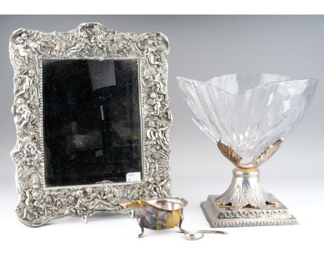 A Xavier crystal large glass bowl on stand, the Indian metal stand cast as a square plinth with leaf shaped central supports,