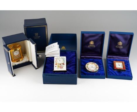 Four various Halcyon Days quartz movement clocks, comprising a miniature carriage clock of oval form, gilt and floral decorat