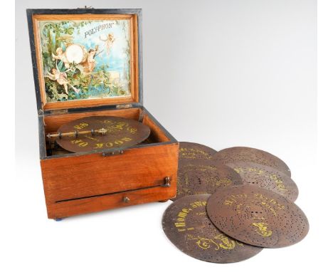 A late 19th century German walnut cased table top polyphon of square form, incised floral decoration to the hinged lid, paper
