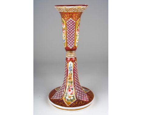A Bohemian glass and enamelled vase \ candlestick, in two sections the pink glass with gilt decoration, painted floral panels