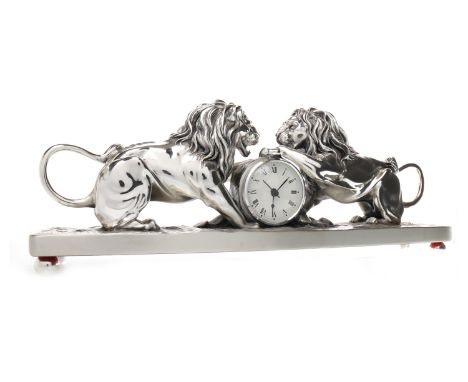 CONTEMPORARY SCULPTURAL CLOCK BY OTTAVIANIthe white dial with Roman numerals, contained within a silvered circular case flank