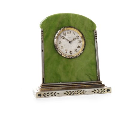 ART DECO DESK CLOCK BY CARTIERwith 8 day movement, the signed silvered dial with luminous Arabic numerals and hands, the neph
