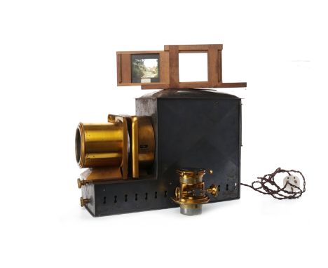 EARLY 20TH CENTURY MAGIC LANTERN BY W.B. & SONSwith adjustable lens, the brass and blackened body with maker's plaque to rear