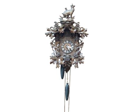 Black Forest carved cuckoo clock (pendulum and two weighs present)