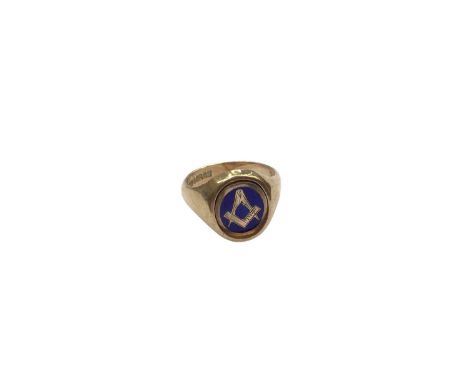 9ct gold Masonic signet ring with rotating panel depicting blue enamel decoration to one side and engraved monogram to the ot