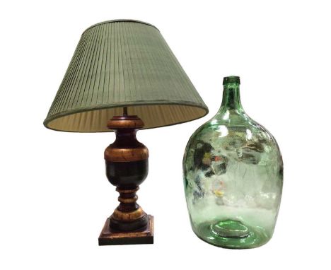 Decorative painted wood table lamp with shade and a vintage green glass carboy