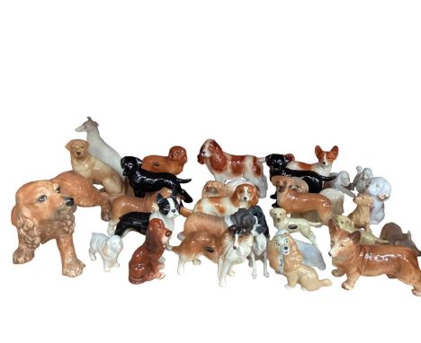 Collection of dog ornaments, various manufacturers including Wade and Coopercraft - 1 shelf