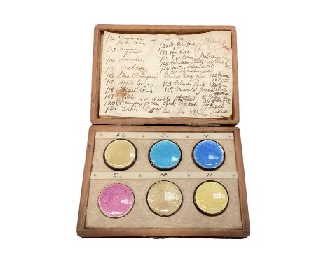 Salesman example cased set of enamel lids
