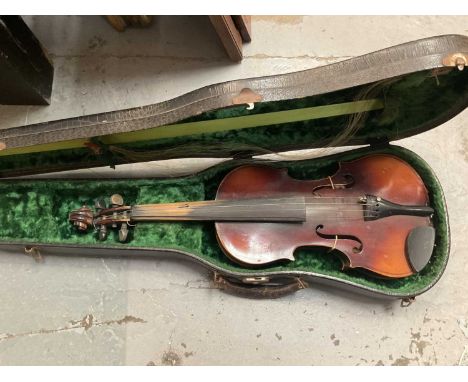 Old violin with Stradivarius label, and bow in case