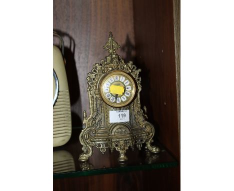 A METAL MANTEL CLOCK