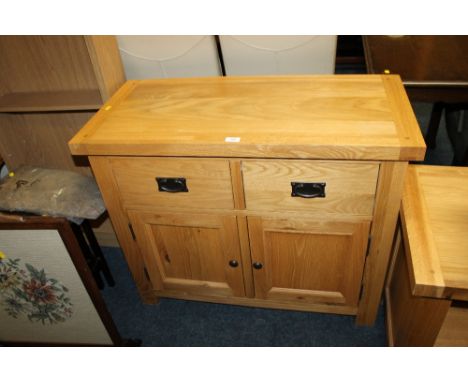A MODERN LIGHT OAK SMALL SIDEBOARD