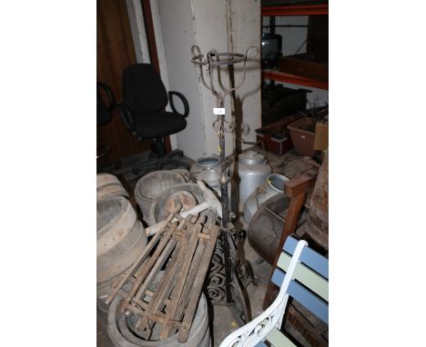A WROUGHT IRON TELESCOPIC CANDLE STAND/LIGHT HOLDER