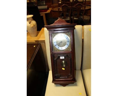 A MODERN METAMEC WALL CLOCK