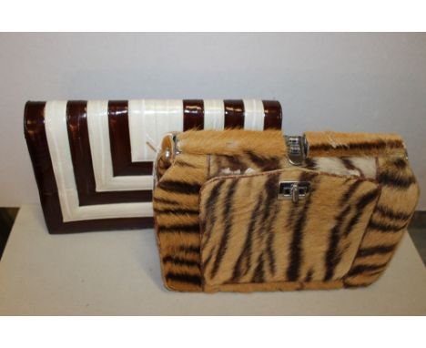 A VINTAGE FUR BAG, probably antelope family, chrome metal closures, drop down front panel with inset mirror, W 26 cm, H 17 cm