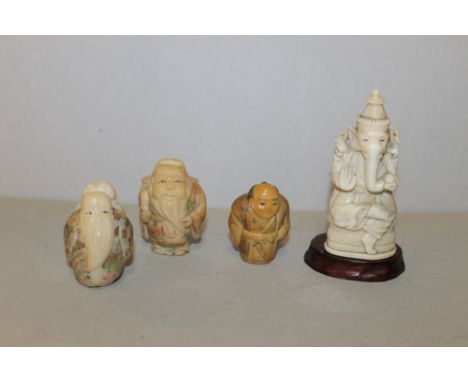 A CARVED ORIENTAL OKIMONO OF AN ASIAN DEITY, in the form of an anthropomorphic elephant, H 8.5 cm, together with two okimono 