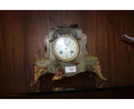 A GILT ONYX MANTEL CLOCK  A/F