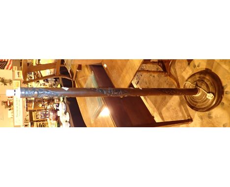 Wooden standard lamp carved with dragon detail to column  CONDITION REPORT: All electrical items in this lot have been PAT te