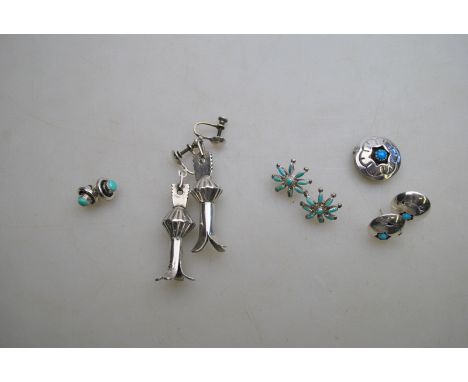 A pair of Navajo white metal earrings designed as Squash Blossom; together with a turquoise-set Navajo button and three other