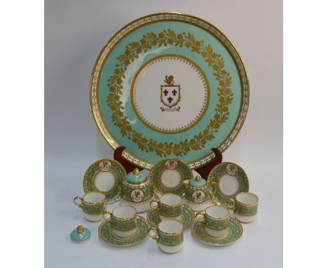 A 19th century Davenport porcelain armorial cabaret set, turquoise ground decorated with floral raised gilding, the circular 