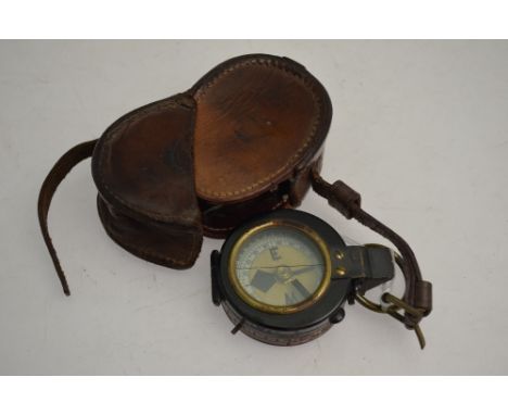 A brass & Japanned metal pocket bearing compass in leather case
