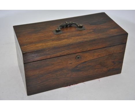 A 19th century rosewood tea caddy, the rectangular top with gilt metal handle enclosing a pair of lidded boxes flanking a cir