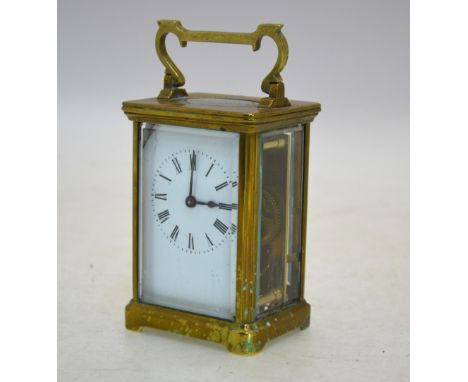 An English brass carriage clock with enamel dial, 15 cm high (including handle), and  a French brass carriage clock with enam