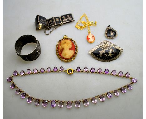 A graduated oval amethyst riviere necklace in gilt metal claw setting to/w niello plaque bracelet, fan brooch and pendant, Ea